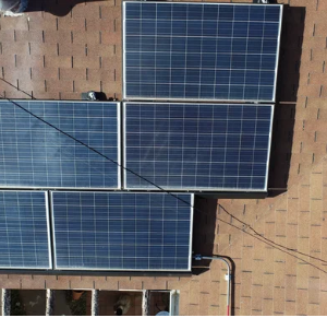 Solar panel inspection on a rooftop for optimal energy efficiency and maintenance.