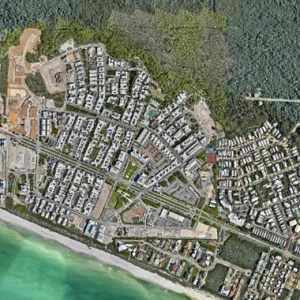 Aerial view of Alys Beach coastal community, homes, roads, shoreline, and natural preserve.