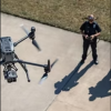 Drone Operator Guiding UAV in Flight