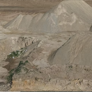 Drone Services in Glendale Arizona shows aerial sand and gravel mounds at mining site.
