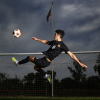 Dramatic Soccer Goalkeeper Leaps for Crucial Save