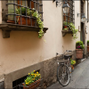 Vintage Bicycle in a Flower-Lined European Alley
