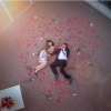Romantic Couple in Heart of Rose Petals