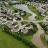 Aerial View of Suburban Neighborhood With Pond