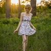 Woman in a Sunset Meadow Field