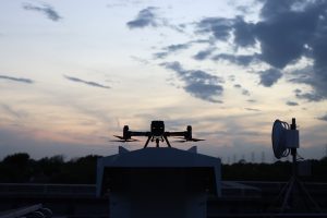 Drone on Rooftop at Twilight Sunset