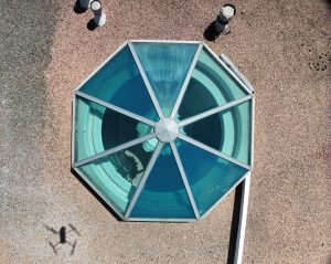 Aerial View of Octagonal Glass Pool Pavilion