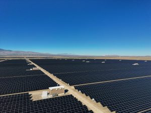 Vast Desert Solar Farm Under Clear Blue Skies