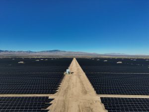 Vast Solar Farm Under Clear Blue Sky