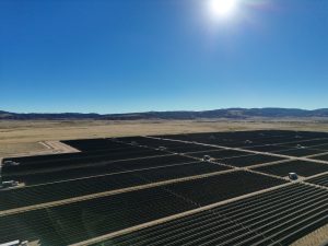 Solar Farm Under Bright Sun in Rolling Hills