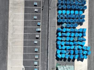 Aerial View of Blue Containers in Parking Lot