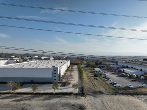 Modern Industrial Warehouse Complex Under Blue Sky