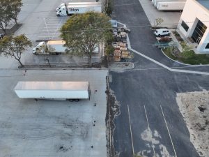Aerial View of Busy Logistics Center Parking Lot