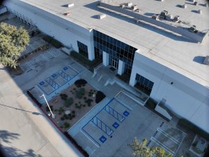 Aerial View of Modern Commercial Building and Parking