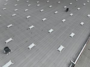 Modern Flat Roof With Skylights and Vents