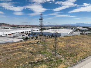 Power Lines Over Industrial Park Landscape
