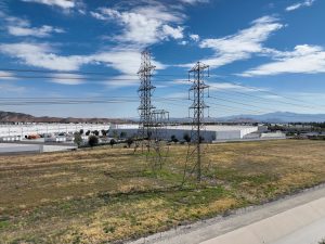 Power Pylons Over Industrial Landscape
