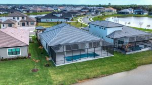 Modern Suburban Homes With Pool And Lake Views Shot By A Drone Operator