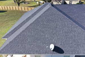 Aerial View of Gray Shingle Roof With Satellite Dish