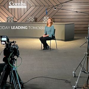 Comcast corporate video interview setup with studio lighting, cameras, and branded office backdrop.