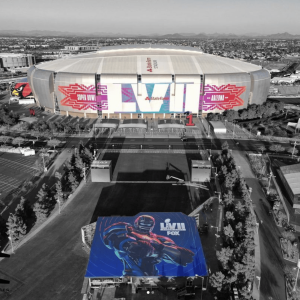 Aerial view of Super Bowl LVII stadium in Glendale, Arizona with football mural.